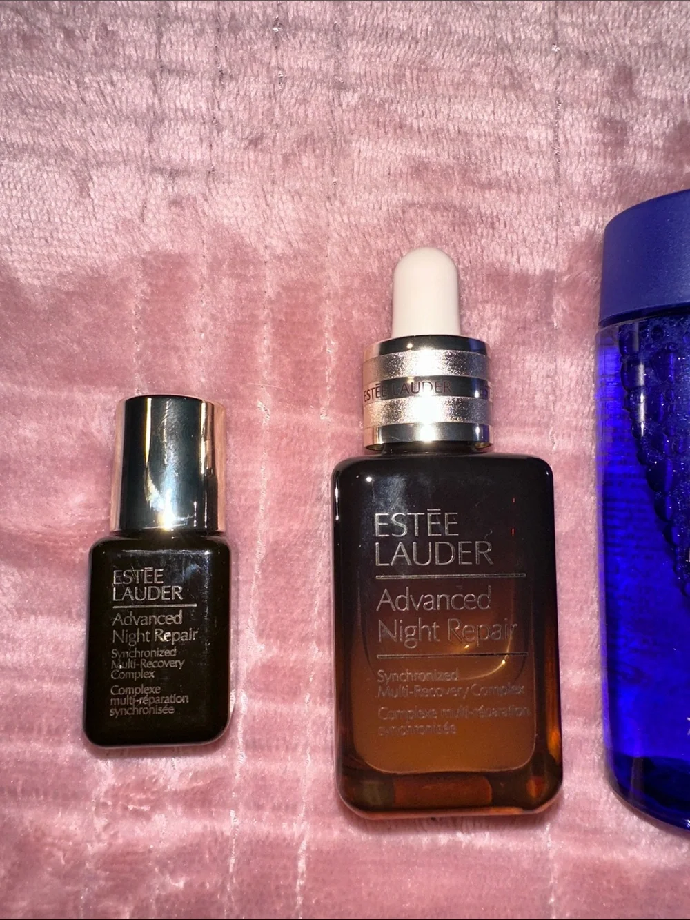 Estee Lauder Skincare Assortment with Blue, Pink, Gold and Brown Accents